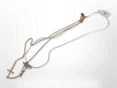 A silver crucifix on snake chain and a Milor bronze Italian cross on chain.