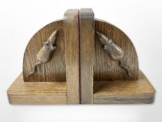 A pair of oak bookends each with carved mouse, height 15 cm.