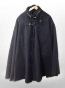 A police black woollen cape.