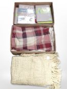 Several packs of duvet covers, woollen throws and blankets, etc.