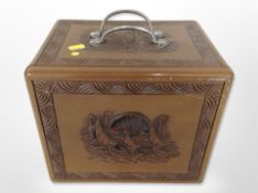 An oriental carved camphor wood box, with drawers to interior, width 27cm.