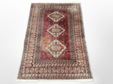 An Afghan rug of geometric design,