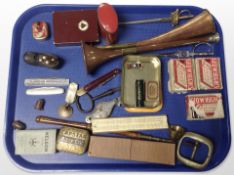 A group of collectibles including copper horns, letter knives in the form of swords, antique rule,