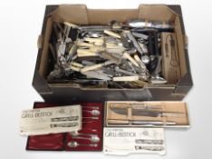 A large quantity of boxed and unboxed cutlery.