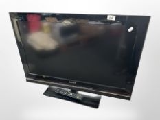 A Sony Bravia 32-inch LCD TV with lead and remote.