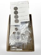 A collection of 50p coins, Beatrix Potter etc.