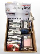 A Sony Playstation 1 console in box, together with various Playstation 2, Xbox and Nintendo games.