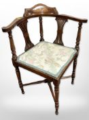 A late Victorian inlaid mahogany corner armchair