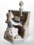 A Lladró figure,'Practice Makes Perfect', no. 5462.