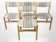 A set of four Danish beech framed dining chairs in striped oatmeal fabric