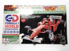A 1:6 scale radio controlled Formula 1 car, in box.