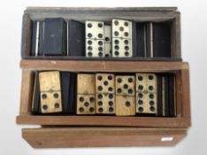 Two sets of dominoes in wooden cases