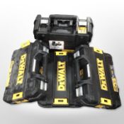 Four empty DeWalt tool cases.