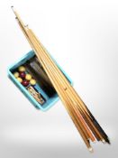 A quantity of billiard cues,