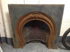 A late Victorian cast iron fire insert,