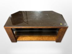 A contemporary glass topped tv stand,