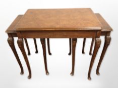 A figured walnut nest of three tables,