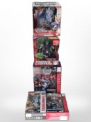 Five Hasbro Transformers figurines, boxed.