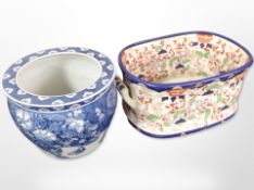 A reproduction Staffordshire Ironstone twin-handled footbath, width 46cm,