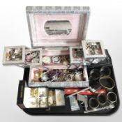 An ornate jewellery box in the form of a book containing mixed costume jewellery,