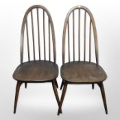 A pair of Ercol stained spindle backed dining chairs