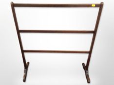 A mahogany towel rail