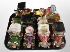 Eight ceramic models of classic cars, some marked 'Italy' to underside.