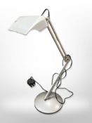 An angle poise metal table lamp marked Lival, Finland, on a very heavy weighted circular base,