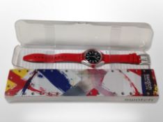 A Swatch watch, in box, model YES4001 Aluminium.