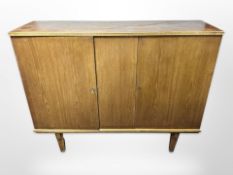 A 20th century Danish teak sideboard fitted with two cupboards,