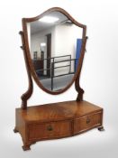 A 20th century mahogany shield-shaped dressing table mirror,