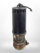 A 19th-century Johnson, Clapham & Morris of Manchester deflector miner's lamp.