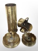 A group of trench art items including vase, two ash trays, and coal scuttle, tallest 23cm.
