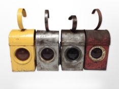 Four metal road lamps.