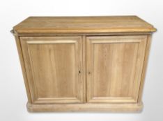 An early 20th century Scandinavian pine double door side cabinet,