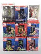 Seven DC Comics superhero figurines, a further Marvel figurine, and a Funko Evolve figurine,