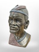 A cold-cast bronze bust of an African man by Casper Darare, number 339/400,
