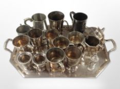 A silver plated octagonal serving tray containing assorted mugs and tankards, coal scuttle,