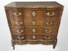 A 19th century Scandinavian oak serpentine fronted chest of four drawers,