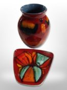 A Poole pottery vase, height 16cm, and a further shallow dish.