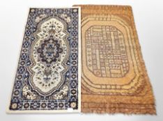 A 1970's woolen rug on orange ground,