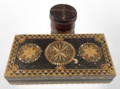 An early 20th-century cigarette tin clad in leather, possibly a prisoner of war piece,