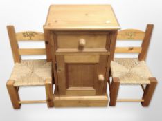 A contemporary pine bedside chest,