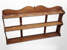 A 20th century mahogany three tier wall shelf,