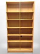 A Danish oak veneered open bookcase,