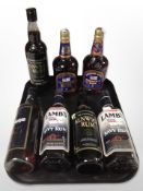 Seven various bottles of rum including Lamb's, British Navy Pusser's rum, Captain Morgan, etc.