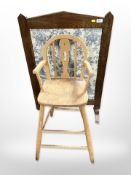 An oak embroidered fire screen,