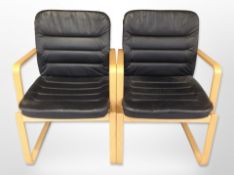 A pair of Kinnarps bentwood and black stitched leather armchairs,