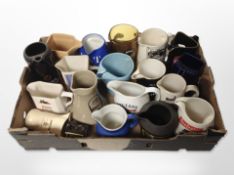 A collection of ceramic whisky jugs bearing various advertising.