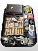 A group of crowns, stainless steel cutlery, vintage AA badge, etc.